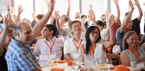 Parents raising hands